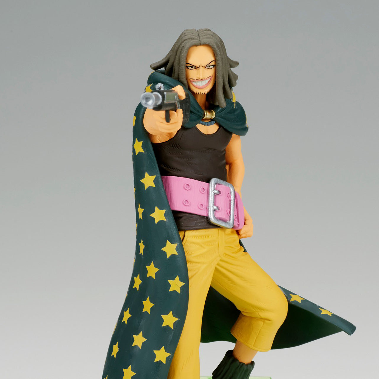Figurine de Yasopp, tireur d'élite de One Piece, mesurant 12 cm, dans une pose dynamique avec une arme à la main, reposant sur une note de musique.