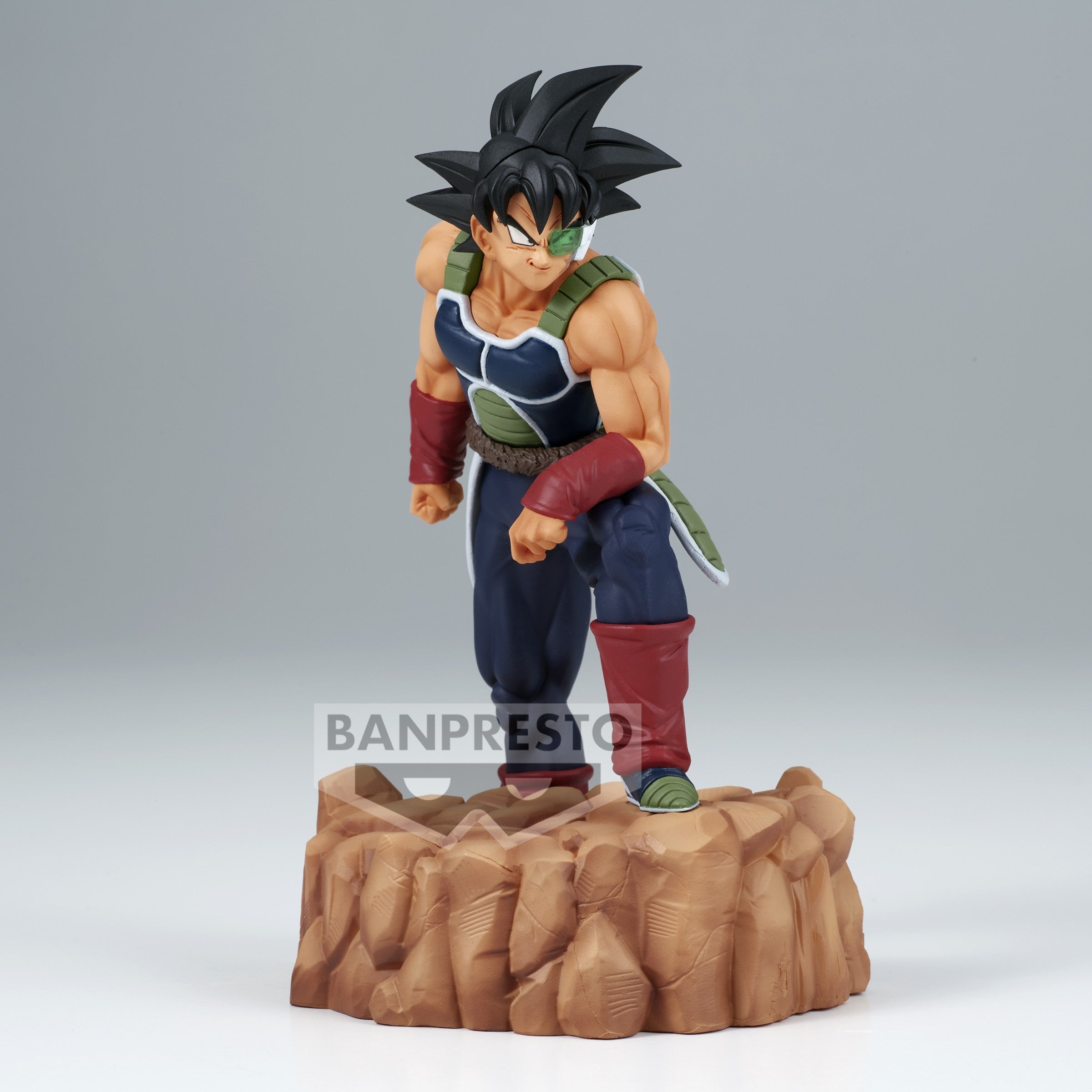 Figurine de Bardock en armure noire et verte sans épaulettes, portant un scouter vert, représentant un Saiyan de la collection History Box.