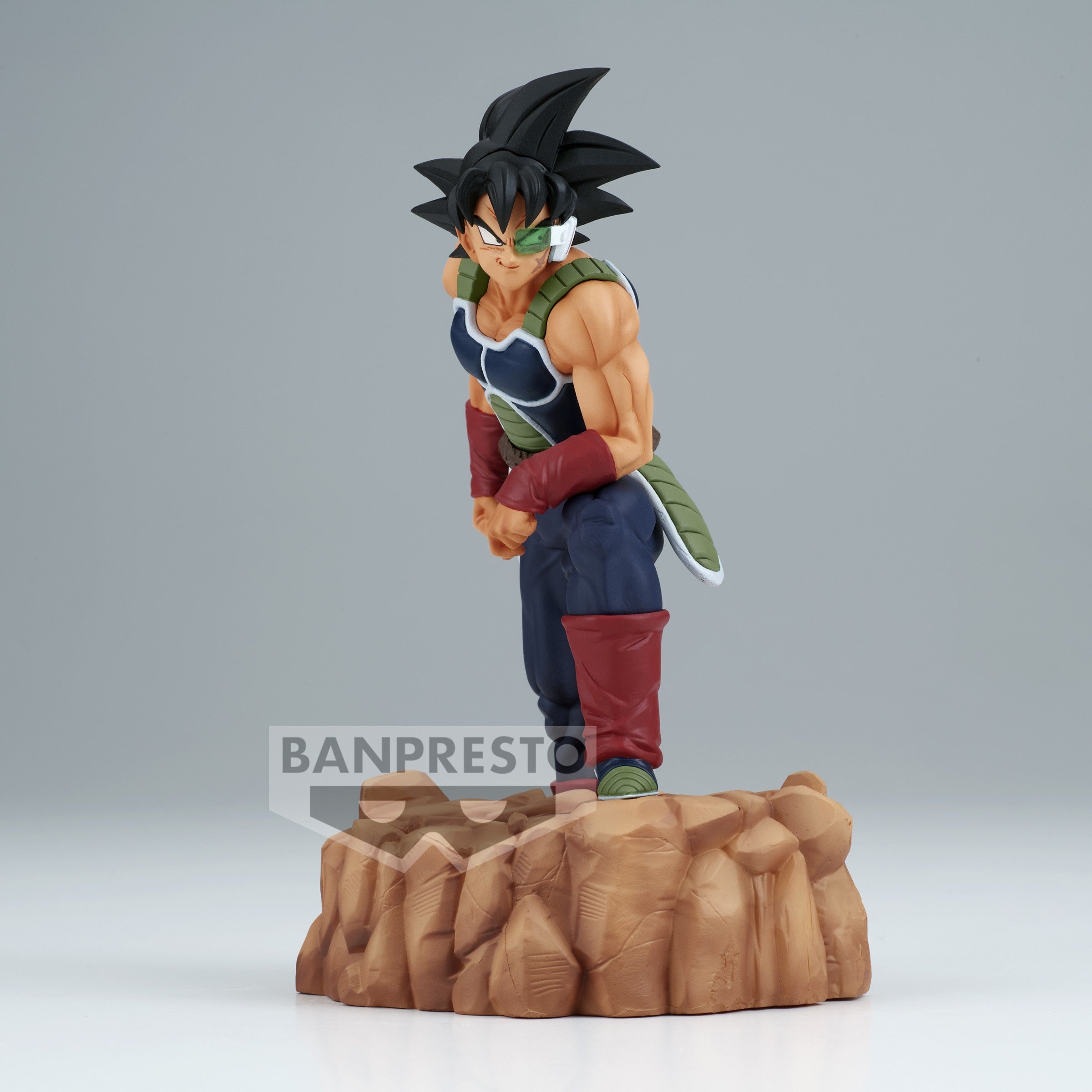 Figurine de Bardock en armure noire et verte sans épaulettes, portant un scouter vert, représentant un Saiyan de la collection History Box.