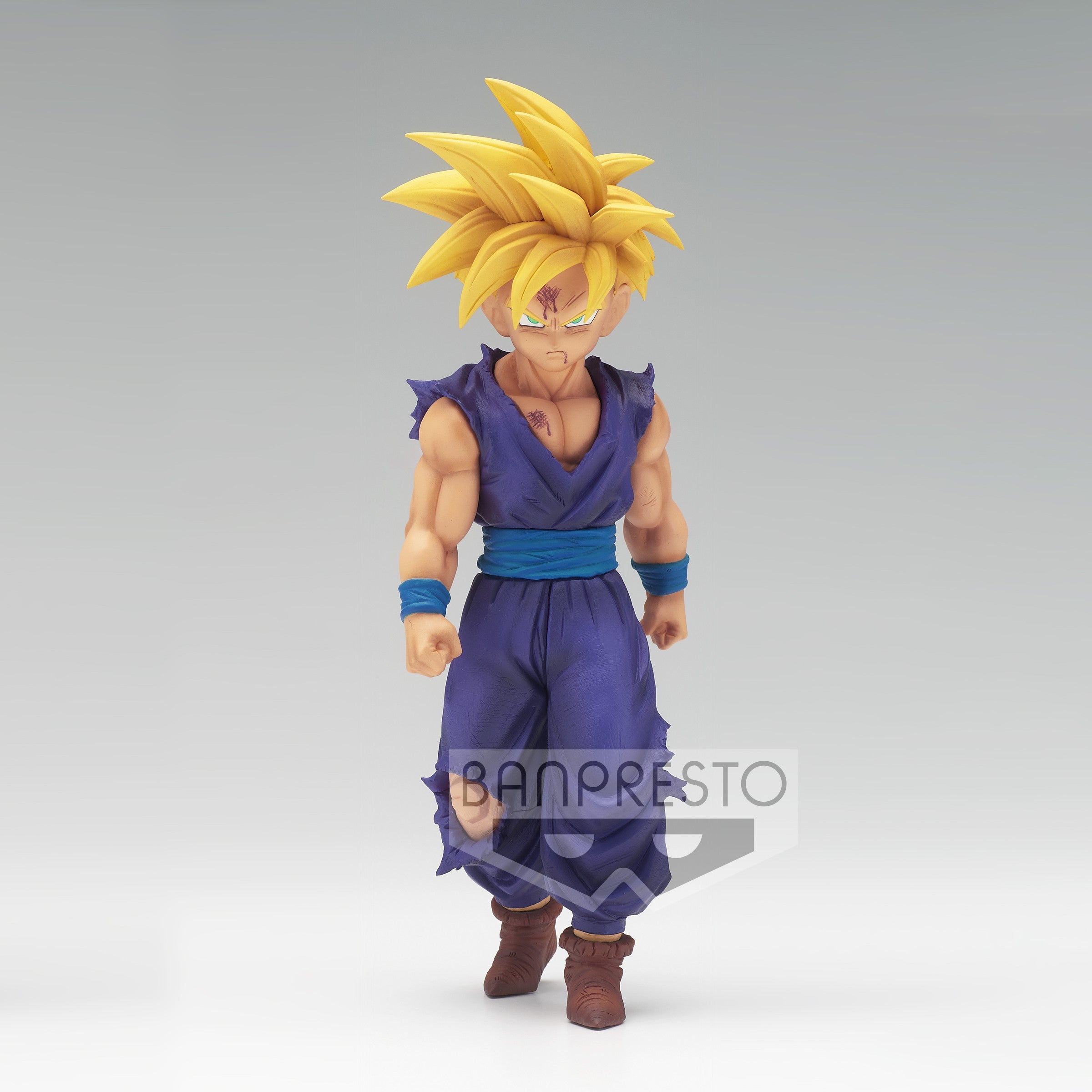 Figurine de Son Gohan en Super Saiyan, mesurant 16 cm, représentant le personnage dans une posture déterminée, avec des détails précis sur son costume et son expression.