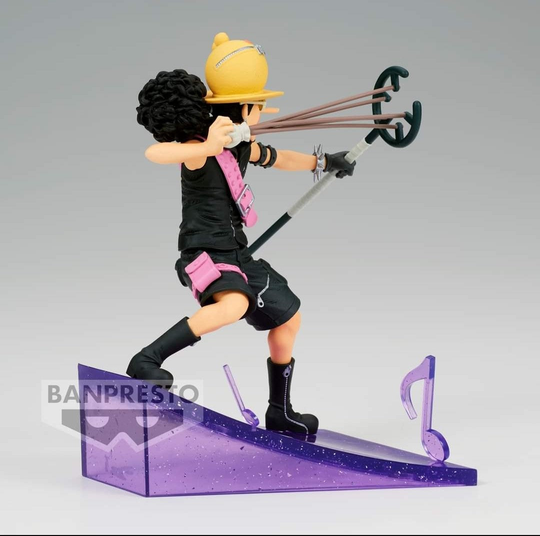 Figurine d'Usopp dans une posture dynamique, avec un socle orné de notes de musique, fabriquée en PVC par Banpresto.