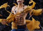 jujutsu-kaisen-figurine-sukuna-25-cm-estream_5 Figurine de Ryomen Sukuna de la série Jujutsu Kaisen, torse nu avec un manteau jaune déchiré, en posture intense avec expression féroce, vue de face à mi-distance.
