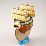 Figurine du Bateau Restaurant Barratie représentant un navire avec des voiles majestueuses et des canons, fabriquée par Bandai, montrant des détails minutieux et des éléments décoratifs comme des drapeaux flottants.