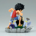Figurine de Luffy en PVC mesurant 7 cm, représentant le personnage en pleine action écrasant Arlong au sol, avec une expression déterminée et une pose dynamique, fabriquée par Banpresto.